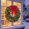 Christmas Decoration, 24 in Pre-Lit Crestwood Spruce Artificial Christmas Wreath, Bow, 50 LED Lights, Green